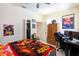 Inviting bedroom with ceiling fan, closet, neutral paint, and tile floors at 209 Arlington E Ave, Oldsmar, FL 34677