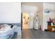 Cluttered garage with access to the house, featuring a hot water heater and storage solutions at 209 Arlington E Ave, Oldsmar, FL 34677