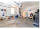 Spacious garage featuring a convenient interior access door and a bright window at 209 Arlington E Ave, Oldsmar, FL 34677