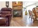 Inviting living room with stone fireplace, hardwood floors, and comfortable furnishings creating a cozy ambiance at 209 Arlington E Ave, Oldsmar, FL 34677