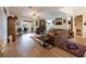 Cozy living room with hardwood floors, fireplace, and sliding door to pool at 209 Arlington E Ave, Oldsmar, FL 34677