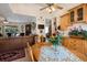 Open concept layout connecting the dining area to a comfortable living space with a fireplace at 209 Arlington E Ave, Oldsmar, FL 34677