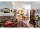 Spacious living area with hardwood floors and comfortable seating that connects the dining area to the living room at 209 Arlington E Ave, Oldsmar, FL 34677
