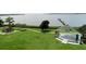 Scenic park view showcasing a picturesque waterfront with a pier and an outdoor community stage at 209 Arlington E Ave, Oldsmar, FL 34677