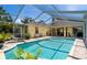 Relaxing screened-in pool area with comfortable seating and well-kept deck at 209 Arlington E Ave, Oldsmar, FL 34677