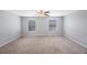 Bright, carpeted bedroom with natural light streaming through two windows, offering a peaceful and serene retreat at 2227 Golden Falcon Dr, Ruskin, FL 33570