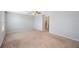 Large bedroom with soft carpet, a ceiling fan, and a glimpse into an adjacent bathroom, creating a comfortable atmosphere at 2227 Golden Falcon Dr, Ruskin, FL 33570