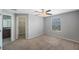 Bedroom featuring a ceiling fan, carpet flooring, and a walk-in closet at 2227 Golden Falcon Dr, Ruskin, FL 33570