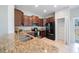 Well-equipped kitchen with ample cabinet space, granite countertops, stainless steel appliances, and a walk-in pantry at 2227 Golden Falcon Dr, Ruskin, FL 33570