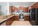 Modern kitchen featuring stainless steel appliances, granite countertops, and rich cabinetry for a contemporary feel at 2227 Golden Falcon Dr, Ruskin, FL 33570