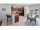 Bright kitchen featuring a breakfast bar, stainless steel appliances, and cozy dining area with natural light at 2227 Golden Falcon Dr, Ruskin, FL 33570