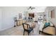 Open-concept living room featuring modern décor, tile flooring, and a smooth transition to the kitchen and dining area at 2227 Golden Falcon Dr, Ruskin, FL 33570