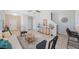 Open living area features modern decor, tile flooring, and seamless connection to the kitchen and dining area at 2227 Golden Falcon Dr, Ruskin, FL 33570