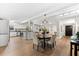 Open concept living space with kitchen, dining area, and entrance featuring hardwood floors at 2257 Lake Dr, Dunedin, FL 34698