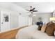 Charming main bedroom features hardwood floors, an ensuite, and ample storage at 2257 Lake Dr, Dunedin, FL 34698