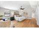 Spacious main bedroom boasts hardwood floors, stylish decor, and ample natural light at 2257 Lake Dr, Dunedin, FL 34698
