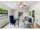 Charming home office features hardwood floors, stylish decor, and serene views at 2257 Lake Dr, Dunedin, FL 34698