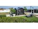 Fenced in backyard featuring a screened-in lanai and outdoor lounging at 3302 W Shell Point Rd, Ruskin, FL 33570