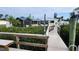 Picturesque backyard featuring lush greenery, a screened in lanai, and access to the waterfront at 3302 W Shell Point Rd, Ruskin, FL 33570