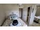 Comfortable bedroom with seaside decor, a closet, and a serene atmosphere for relaxation and rest at 3302 W Shell Point Rd, Ruskin, FL 33570