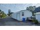 Steel garage featuring side door access and ample storage space at 3302 W Shell Point Rd, Ruskin, FL 33570