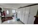 Functional laundry room with washer, dryer, and ample storage cabinets for organization and convenience at 3302 W Shell Point Rd, Ruskin, FL 33570