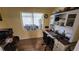 Cozy home office featuring built-in shelving and a comfortable workspace perfect for productivity at 3302 W Shell Point Rd, Ruskin, FL 33570