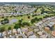 See this aerial view showcasing the home's desirable location near lakes and a golf course at 336 Northway Dr, Sun City Center, FL 33573