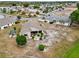 An aerial shot reveals the home's location near perfectly manicured landscaping at 336 Northway Dr, Sun City Center, FL 33573