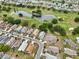 The home is surrounded by ponds and a golf course, as seen in an aerial view at 336 Northway Dr, Sun City Center, FL 33573