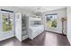 This bedroom has a bunk bed with built-in storage and views of the yard at 336 Northway Dr, Sun City Center, FL 33573