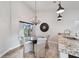 Bright dining area with a modern chandelier and natural light pouring in through the window at 336 Northway Dr, Sun City Center, FL 33573