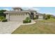 Charming single-Gathering home showcasing a well-manicured lawn, complemented by a two-car garage and neutral paint at 336 Northway Dr, Sun City Center, FL 33573
