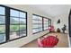 Bright sunroom with large windows and views of manicured landscaping at 336 Northway Dr, Sun City Center, FL 33573