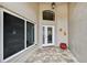 Inviting front porch featuring decorative floor tiles and a beautifully detailed front door, enhancing curb appeal at 336 Northway Dr, Sun City Center, FL 33573