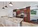Bright kitchen featuring stainless steel appliances, granite countertops, and ample cabinet space at 336 Northway Dr, Sun City Center, FL 33573