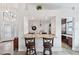 View of the kitchen with granite counters and bar stool seating, ideal for casual dining and entertaining guests at 336 Northway Dr, Sun City Center, FL 33573