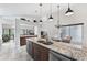 Spacious kitchen with granite countertops, stainless steel appliances, and open floor plan at 336 Northway Dr, Sun City Center, FL 33573