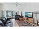 Bright living room featuring tile floors, ceiling fan, and large windows that flood the space with natural light at 336 Northway Dr, Sun City Center, FL 33573