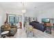 Bright living room featuring tile floors, ceiling fan, and large windows that flood the space with natural light at 336 Northway Dr, Sun City Center, FL 33573