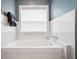 Elegant bathroom featuring a luxurious soaking tub with marble tile surround and modern fixtures at 3408 W San Jose St, Tampa, FL 33629