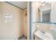 Charming bathroom featuring vintage tile, a sink, and a stand up shower with updated fixtures at 3408 W San Jose St, Tampa, FL 33629