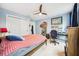 Bedroom featuring a fan, closet, desk and bed at 3408 W San Jose St, Tampa, FL 33629