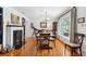 Charming dining room featuring hardwood floors, a fireplace, and ample natural light at 3408 W San Jose St, Tampa, FL 33629