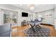 Bright recreational room with a pool table, treadmill, modern lighting, and an outdoor view at 3408 W San Jose St, Tampa, FL 33629