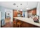 Well-lit kitchen featuring a large island with seating, stainless steel appliances, and ample counter space at 3408 W San Jose St, Tampa, FL 33629