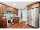 Updated kitchen featuring stainless steel appliances, granite countertops, and ample storage at 3408 W San Jose St, Tampa, FL 33629