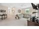 Relaxing living room featuring a comfortable sofa, light colored walls, and a tv at 3408 W San Jose St, Tampa, FL 33629