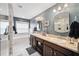 Spacious main bathroom featuring dual sinks, granite countertops, and a separate tub and shower at 3408 W San Jose St, Tampa, FL 33629