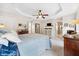 Spacious main bedroom featuring a tray ceiling, ensuite bath access, and neutral decor at 3408 W San Jose St, Tampa, FL 33629